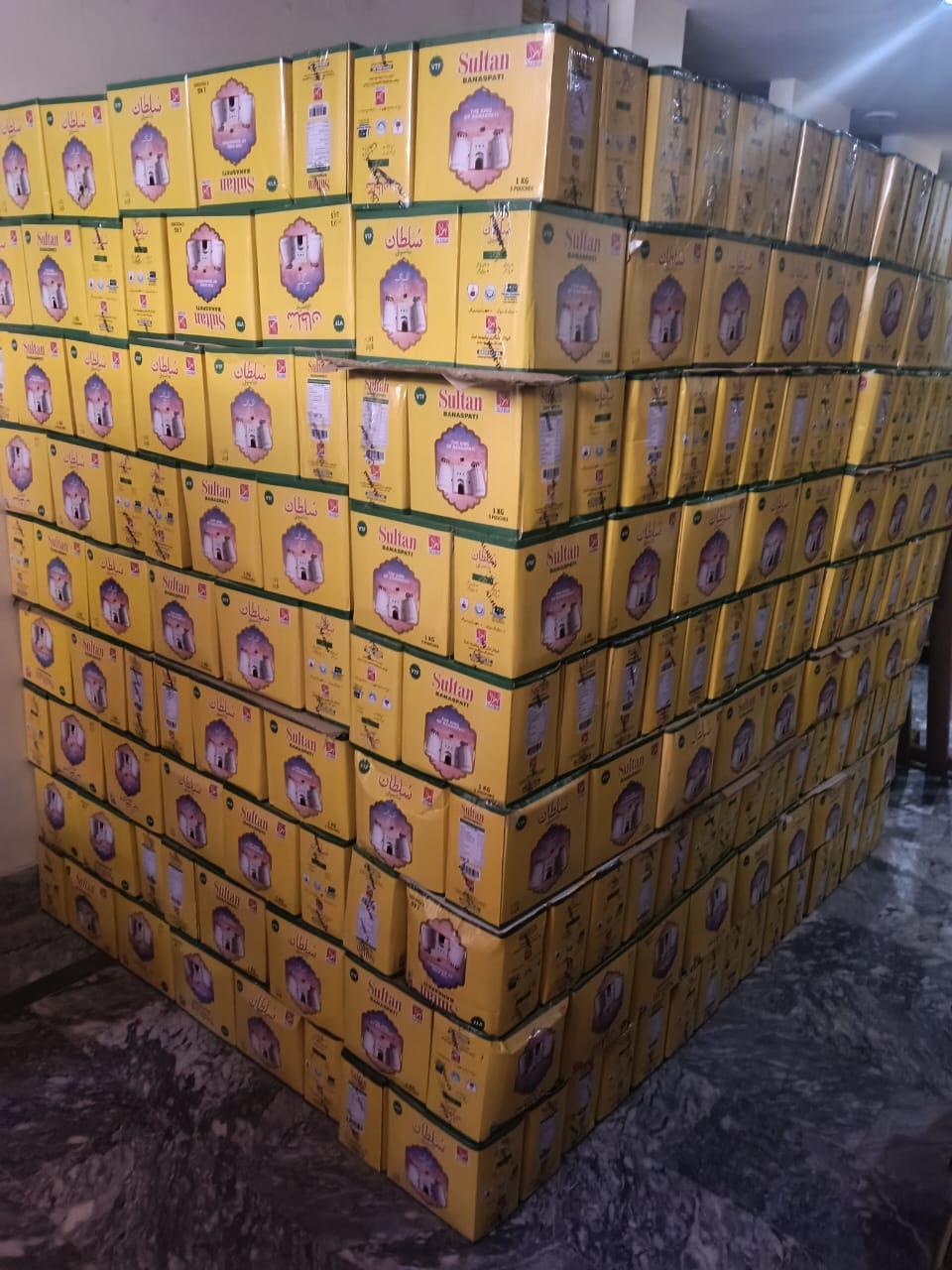 Warehouse aisle stocked with Sultan Banaspati boxes