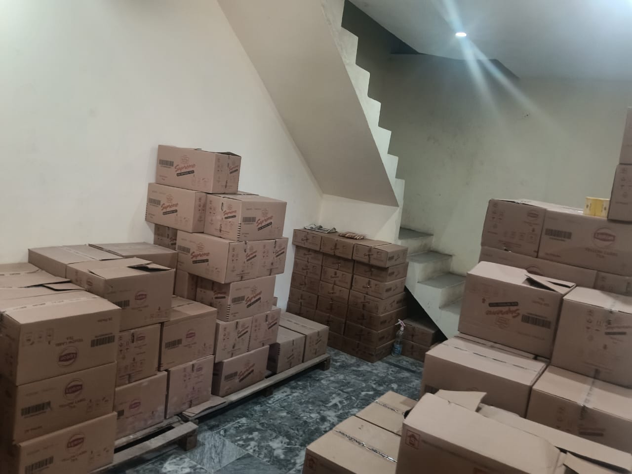 Lipton tea cartons stacked in warehouse
